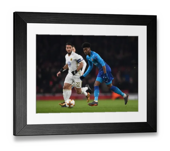 Framed Print : Arsenal's Ainsley Maitland-Niles Goes Head-to-Head with Östersunds Brwa Nouri in Europa League Showdown Framed Print : Arsenal's Ainsley Maitland-Niles Goes Head-to-Head with Östersunds Brwa Nouri in Europa League Showdown