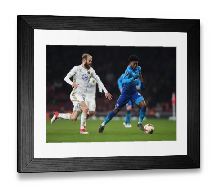 Framed Print : Arsenal's Ainsley Maitland-Niles Faces Off Against Östersunds Curtis Edwards in Europa League Clash