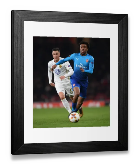 Framed Print : Arsenal's Alex Iwobi Clashes with Östersunds Jamie Hopcutt in Europa League Showdown Framed Print : Arsenal's Alex Iwobi Clashes with Östersunds Jamie Hopcutt in Europa League Showdown
