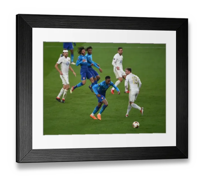 Framed Print : Joe Willock vs. Dennis Widgren: A Europa League Battle at the Emirates