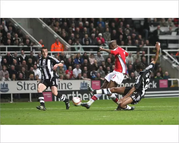Abou Diaby shoots past Newcastle goalkeeper Steve Harper