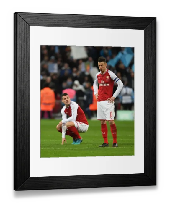 Framed Print : Dejected Duo: Xhaka and Koscielny After Arsenal's Carabao Cup Final Defeat vs Manchester City Framed Print : Dejected Duo: Xhaka and Koscielny After Arsenal's Carabao Cup Final Defeat vs Manchester City