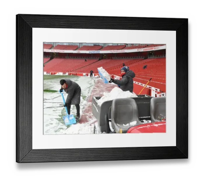 Framed Print : Arsenal Braves the Snow: Preparing Emirates Stadium for Arsenal vs Manchester City, Premier League 2017-18