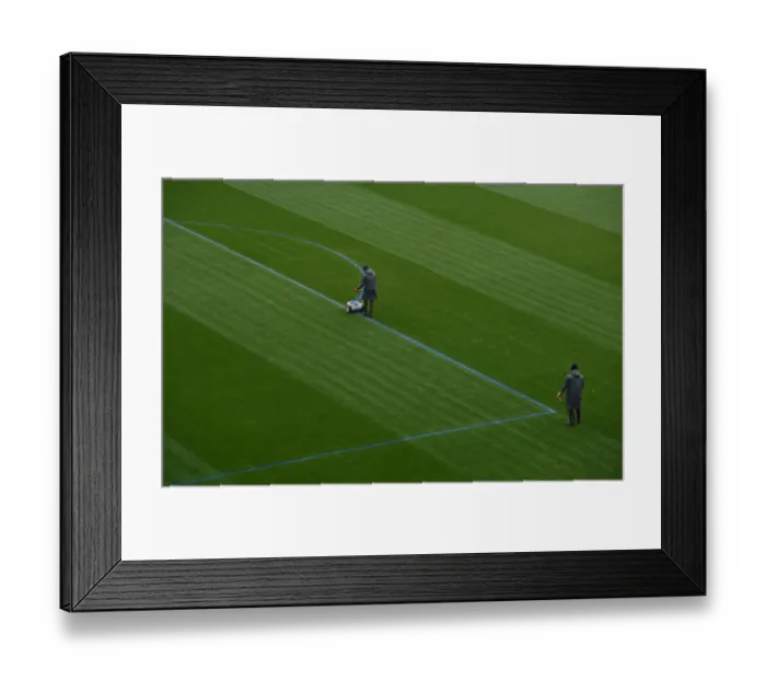 Framed Print : Arsenal Groundstaff Prepare Blue Turf for Premier League Clash against Manchester City Framed Print : Arsenal Groundstaff Prepare Blue Turf for Premier League Clash against Manchester City