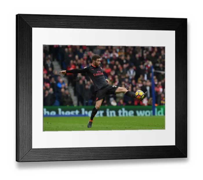 Framed Print : Shkodran Mustafi Focuses in Brighton & Hove Albion vs Arsenal Premier League Clash