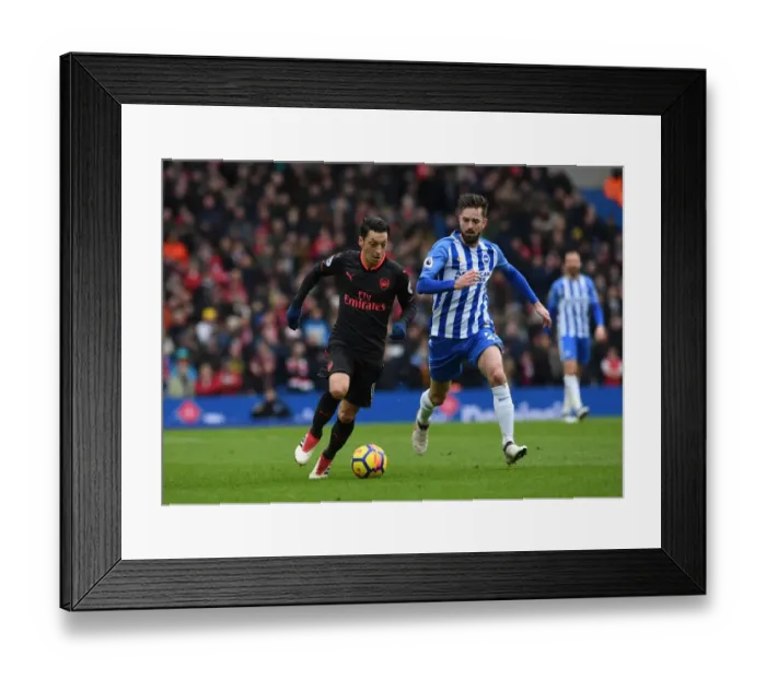 Framed Print : Mesut Ozil vs. Davy Propper: Intense Battle in Brighton and Hove Albion vs. Arsenal Premier League Clash