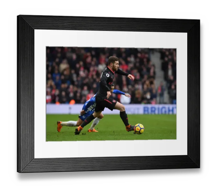 Framed Print : Shkodran Mustafi Focuses in Arsenal's Premier League Clash Against Brighton & Hove Albion Framed Print : Shkodran Mustafi Focuses in Arsenal's Premier League Clash Against Brighton & Hove Albion