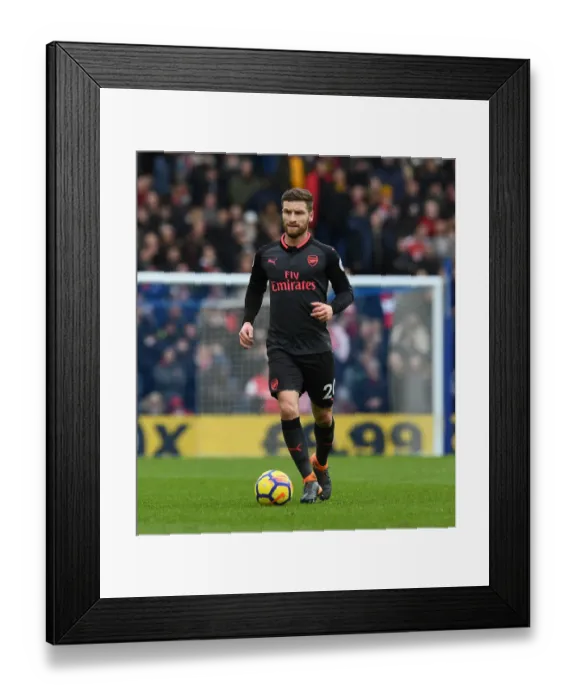 Framed Print : Shkodran Mustafi Focuses in Arsenal's Clash Against Brighton & Hove Albion