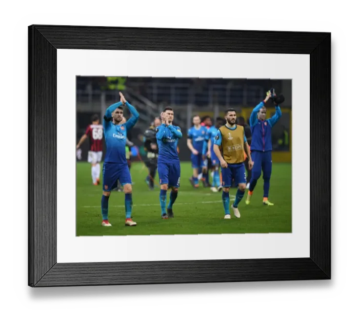 Framed Print : Laurent Koscielny Celebrates with Arsenal Fans after AC Milan Clash in Europa League