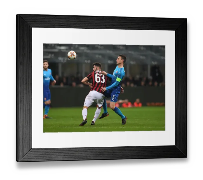 Framed Print : Clash of Titans: Koscielny vs. Cutrone in the Europa League Showdown - Arsenal vs. AC Milan