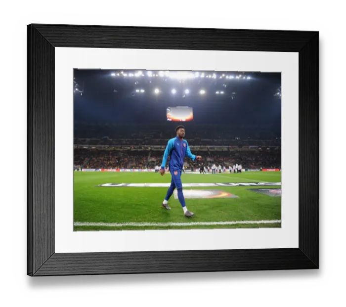 Framed Print : Determined Ainsley Maitland-Niles Faces Off Against AC Milan in Europa League
