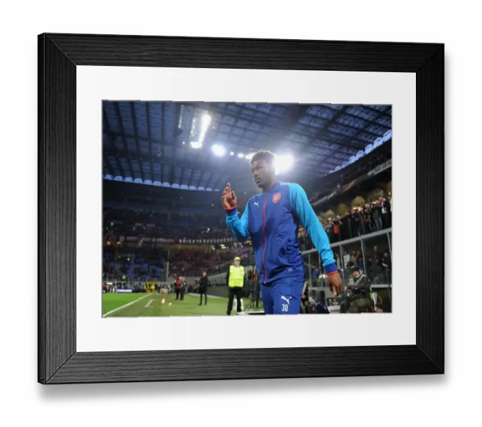 Framed Print : Ainsley Maitland-Niles: Arsenal's Determined Face-off in Europa League Against AC Milan