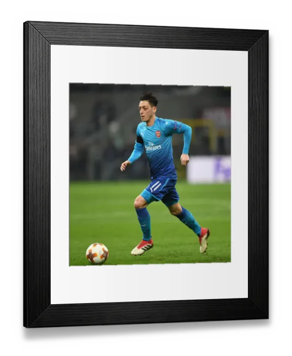 Framed Print : Mesut Ozil in Action: Arsenal vs. AC Milan, UEFA Europa League Round of 16 (First Leg)