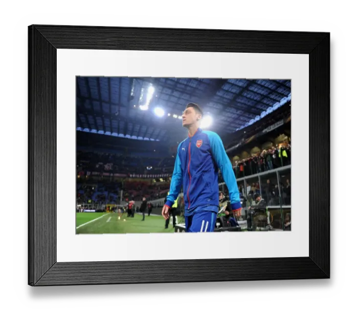 Framed Print : Mesut Ozil's Pre-Match Routine: Arsenal Star Prepares for AC Milan Showdown in Europa League