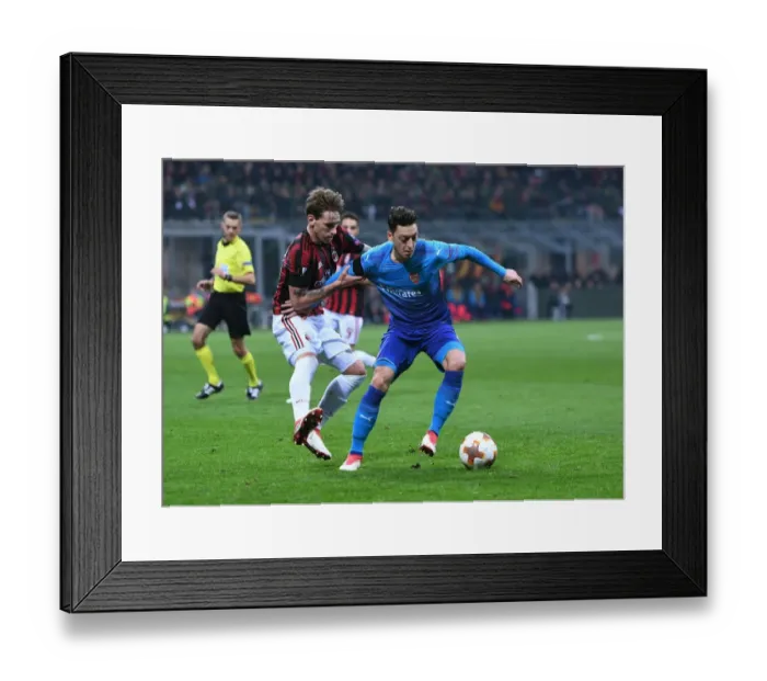 Framed Print : Mesut Ozil vs. Lucas Biglia: Battle in the Europa League - Arsenal vs. AC Milan Framed Print : Mesut Ozil vs. Lucas Biglia: Battle in the Europa League - Arsenal vs. AC Milan
