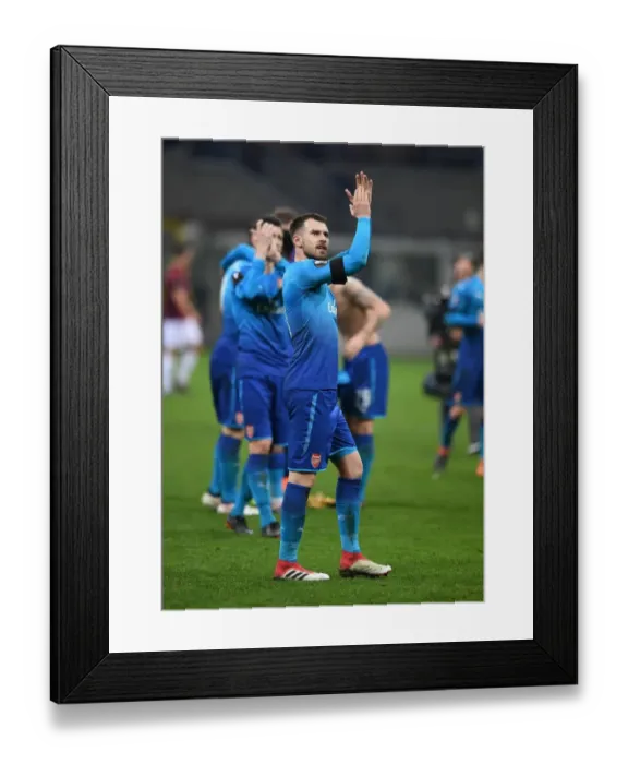 Framed Print : Aaron Ramsey Celebrates with Arsenal Fans after AC Milan Showdown in Europa League Framed Print : Aaron Ramsey Celebrates with Arsenal Fans after AC Milan Showdown in Europa League