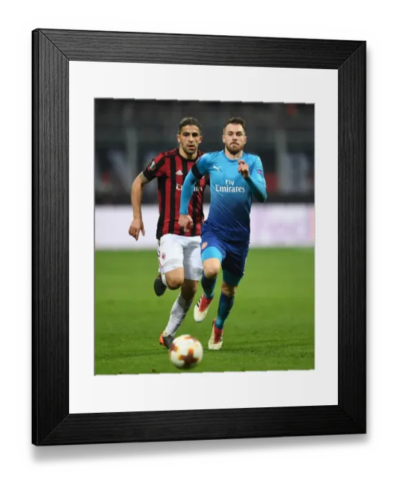 Framed Print : Chasing the Ball: Ramsey vs. Rodriguez in the Europa League Showdown between AC Milan and Arsenal