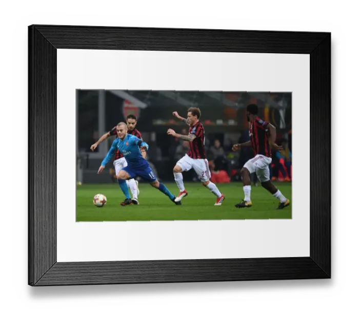 Framed Print : Jack Wilshere vs. Lucas Biglia: Battle in the Europa League - Arsenal vs. AC Milan Framed Print : Jack Wilshere vs. Lucas Biglia: Battle in the Europa League - Arsenal vs. AC Milan