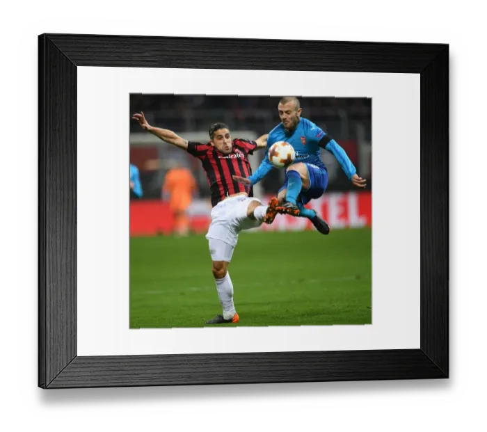 Framed Print : Clash of Titans: Wilshere vs. Rodriguez in the Europa League Showdown - Arsenal vs. AC Milan Framed Print : Clash of Titans: Wilshere vs. Rodriguez in the Europa League Showdown - Arsenal vs. AC Milan