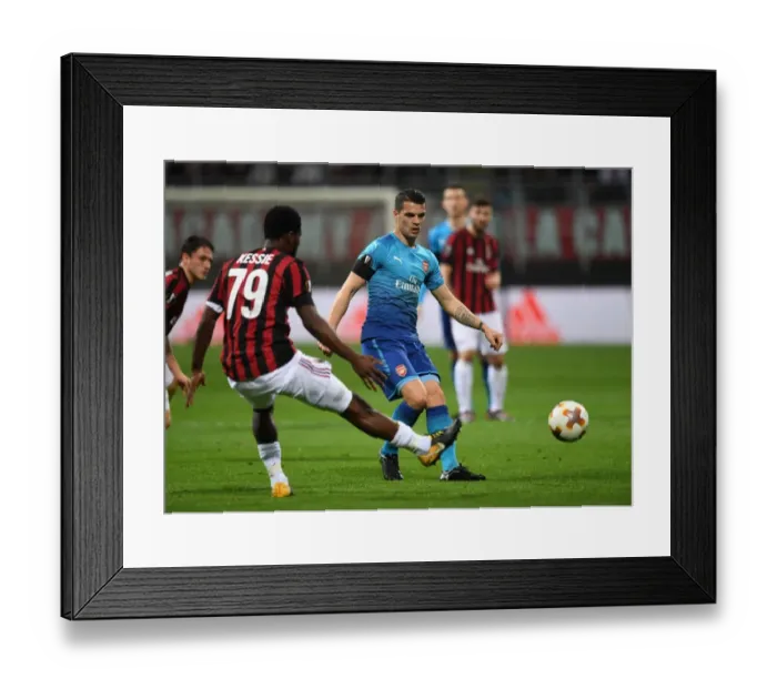 Framed Print : Xhaka vs. Kessie: Battle in the Midfield - AC Milan vs. Arsenal, UEFA Europa League