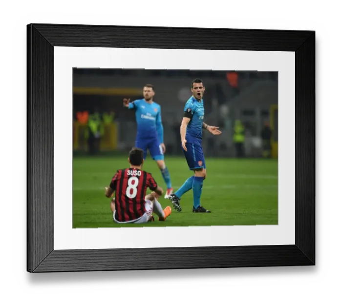 Framed Print : Xhaka vs. Suso: Intense Rivalry in the UEFA Europa League Clash Between AC Milan and Arsenal Framed Print : Xhaka vs. Suso: Intense Rivalry in the UEFA Europa League Clash Between AC Milan and Arsenal