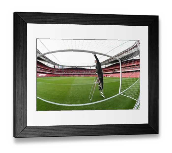 Framed Print : Arsenal Groundsman: Meticulously Preparing Emirates Stadium for Matchday