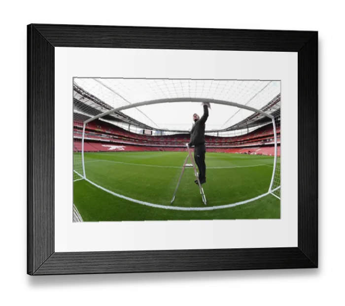 Framed Print : Arsenal Groundsman: Readying Emirates Stadium for Matchday