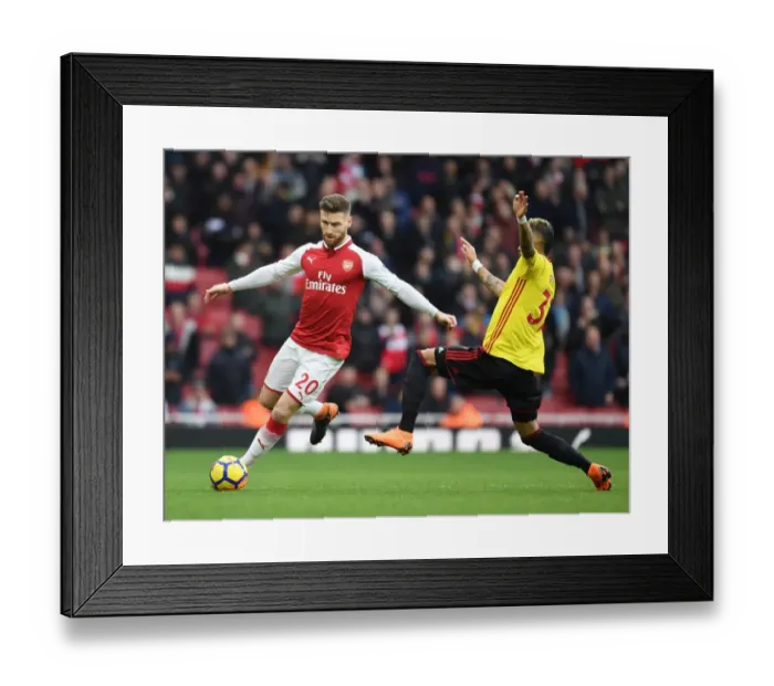 Framed Print : Mustafi vs. Pereyra: Intense Clash Between Arsenal and Watford Players