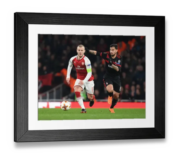 Framed Print : Jack Wilshere vs Suso: Battle in the Arsenal v AC Milan Europa League Clash