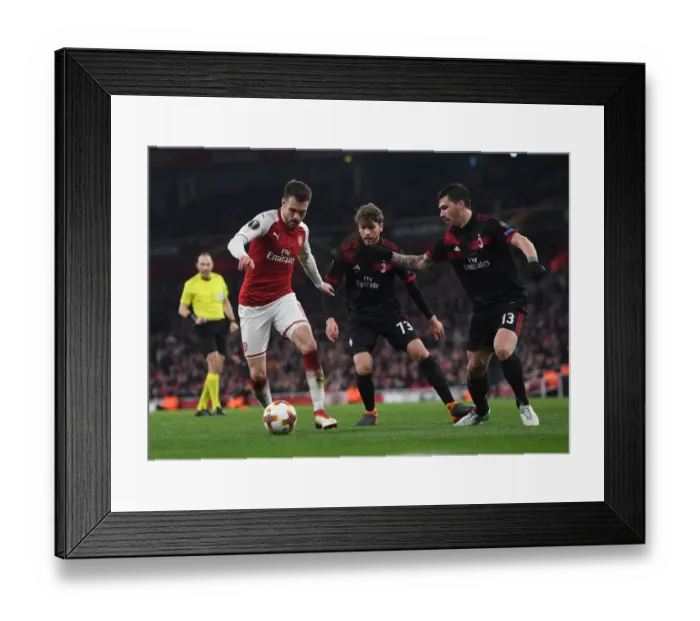 Framed Print : Arsenal vs AC Milan: Clash between Ramsey, Locatelli, and Romagnoli in Europa League Showdown Framed Print : Arsenal vs AC Milan: Clash between Ramsey, Locatelli, and Romagnoli in Europa League Showdown