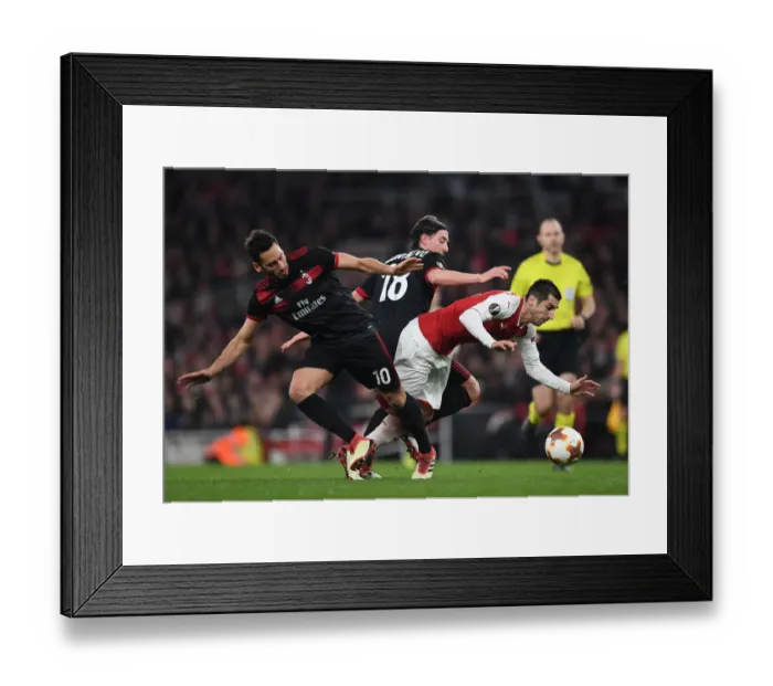 Framed Print : Arsenal's Mkhitaryan Clashes with Calhanoglu and Montolivo in Europa League Showdown
