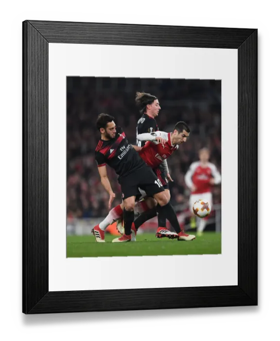 Framed Print : Clash of Midfield Maestros: Mkhitaryan vs Calhanoglu & Montolivo in Arsenal vs AC Milan Europa League Showdown