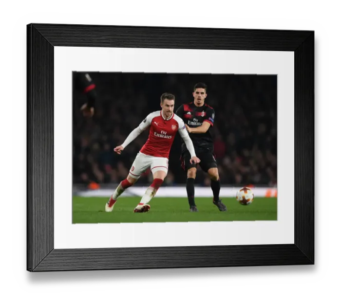 Framed Print : Arsenal's Ramsey Evades Silva Pressure in Europa League Showdown