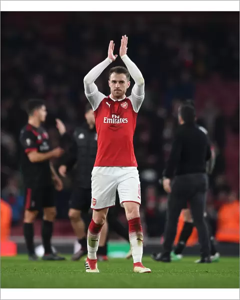Aaron Ramsey Celebrates with Arsenal Fans after Arsenal v AC Milan Europa League Clash