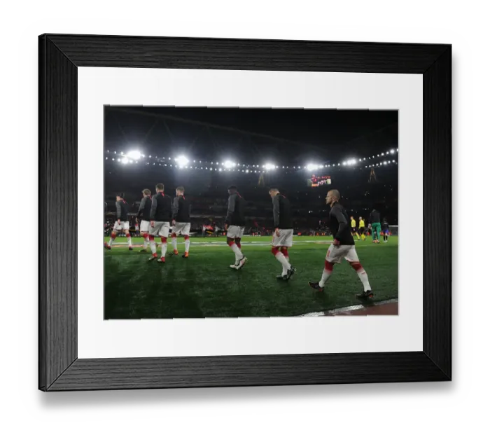 Framed Print : Arsenal Players Walk Out Before Arsenal vs AC Milan Europa League Clash at Emirates Stadium