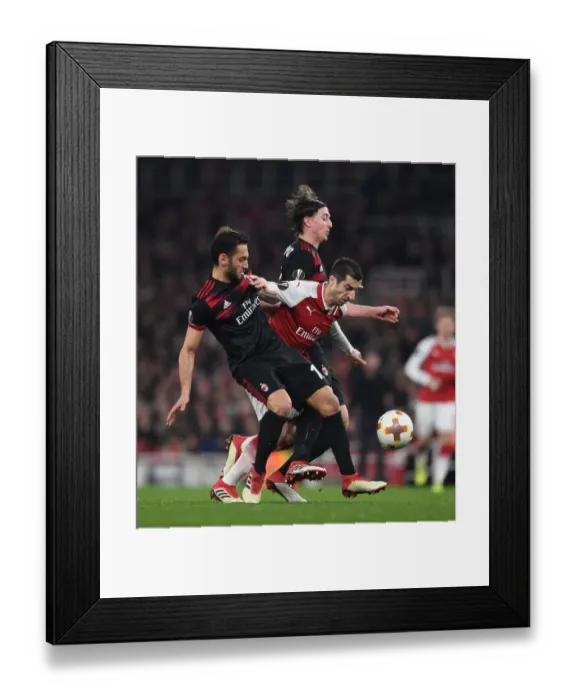 Framed Print : Arsenal's Mkhitaryan Goes Head-to-Head with Calhanoglu and Montolivo of AC Milan in Europa League Showdown