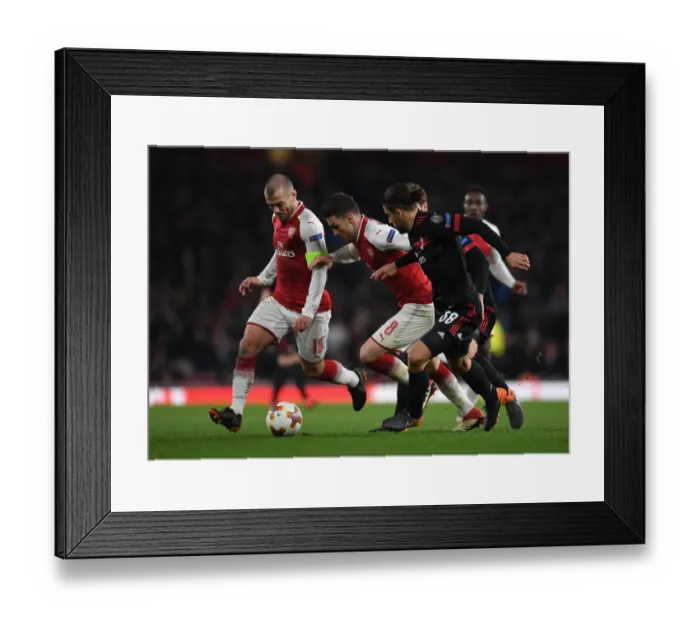 Framed Print : Arsenal's Wilshere and Ramsey Clash with Milan's Rodriguez in Europa League Showdown