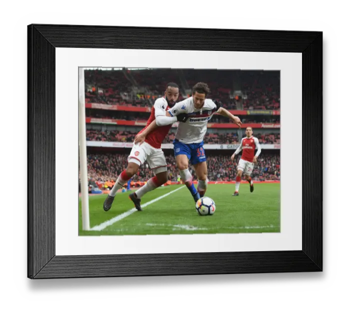 Framed Print : Clash at the Emirates: Lacazette vs. Sobhi in Arsenal's Battle Against Stoke City Framed Print : Clash at the Emirates: Lacazette vs. Sobhi in Arsenal's Battle Against Stoke City
