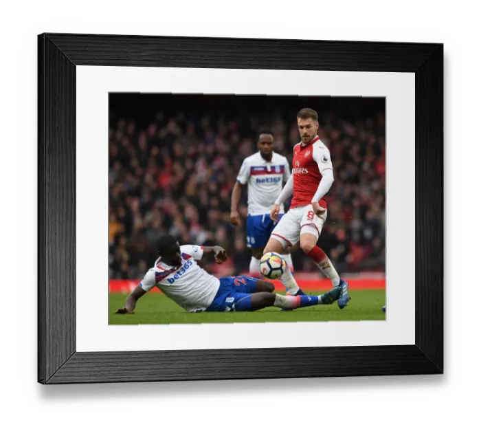 Framed Print : Arsenal's Aaron Ramsey Outsmarts Badou Ndiaye: Premier League Clash