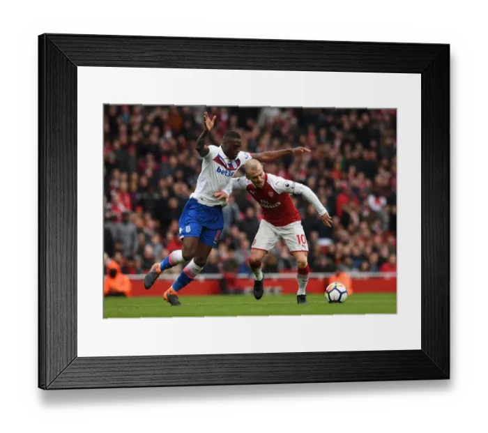Framed Print : Intense Rivalry: Wilshere vs. Martins Indi, Arsenal vs. Stoke City