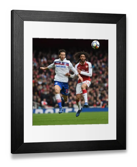 Framed Print : Elneny vs Sobhi: Intense Battle in Arsenal's Victory over Stoke City (April 2018) Framed Print : Elneny vs Sobhi: Intense Battle in Arsenal's Victory over Stoke City (April 2018)