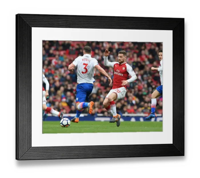 Framed Print : Mustafi vs Pieters: Intense Clash in Arsenal v Stoke City Premier League Match