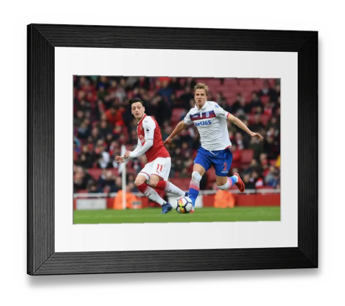 Framed Print : Mesut Ozil vs Moritz Bauer: Intense Battle at Arsenal's Emirates Stadium (Arsenal v Stoke City, 2017-18) Framed Print : Mesut Ozil vs Moritz Bauer: Intense Battle at Arsenal's Emirates Stadium (Arsenal v Stoke City, 2017-18)