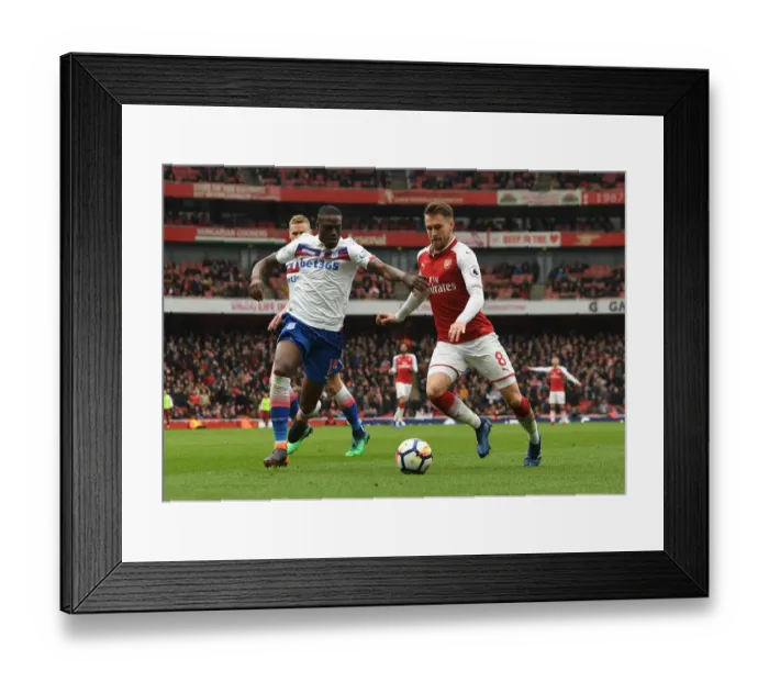 Framed Print : Intense Rivalry: Ramsey vs. Martins Indi - Arsenal's Battle Against Stoke