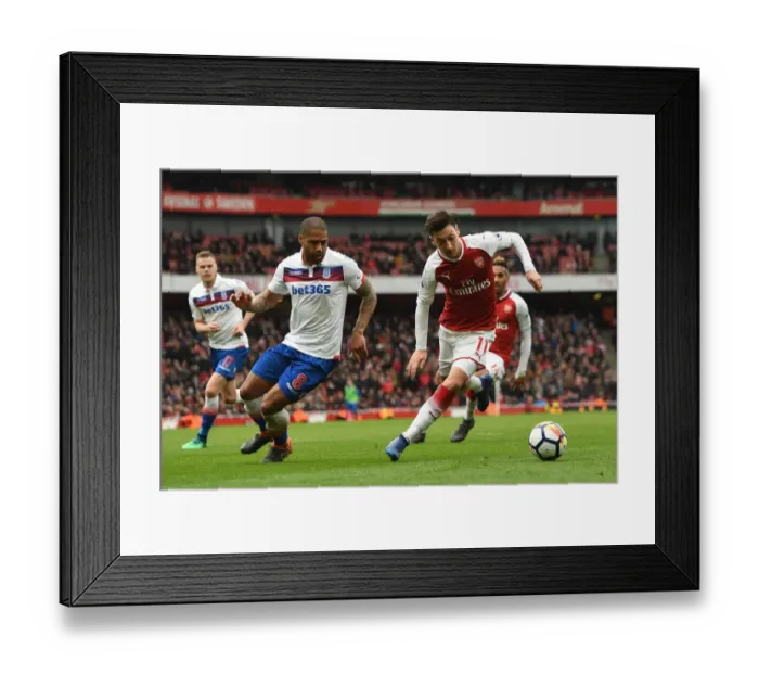 Framed Print : Mesut Ozil vs Glen Johnson: A Premier League Battle at Emirates Stadium Framed Print : Mesut Ozil vs Glen Johnson: A Premier League Battle at Emirates Stadium