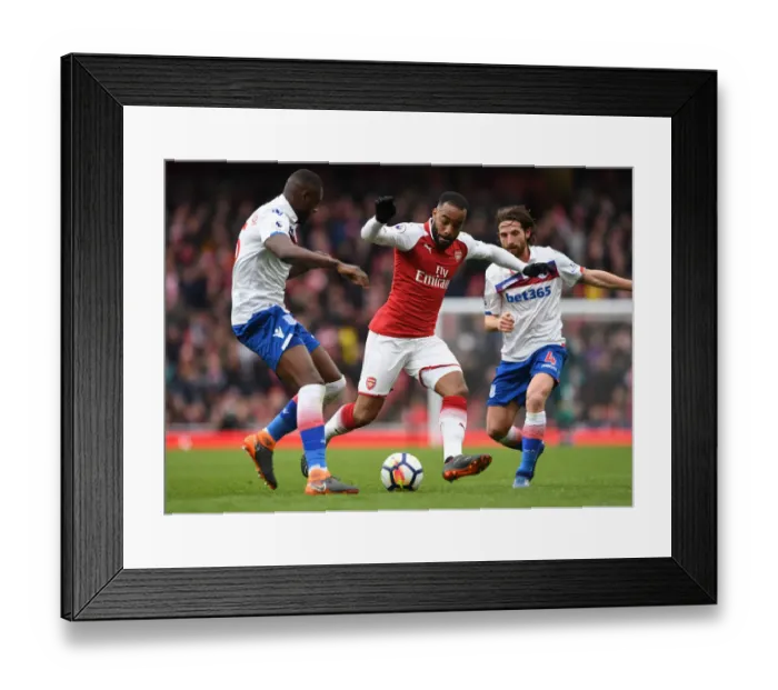 Framed Print : Arsenal's Lacazette Faces Off Against Stoke's Martins Indi and Allen Framed Print : Arsenal's Lacazette Faces Off Against Stoke's Martins Indi and Allen