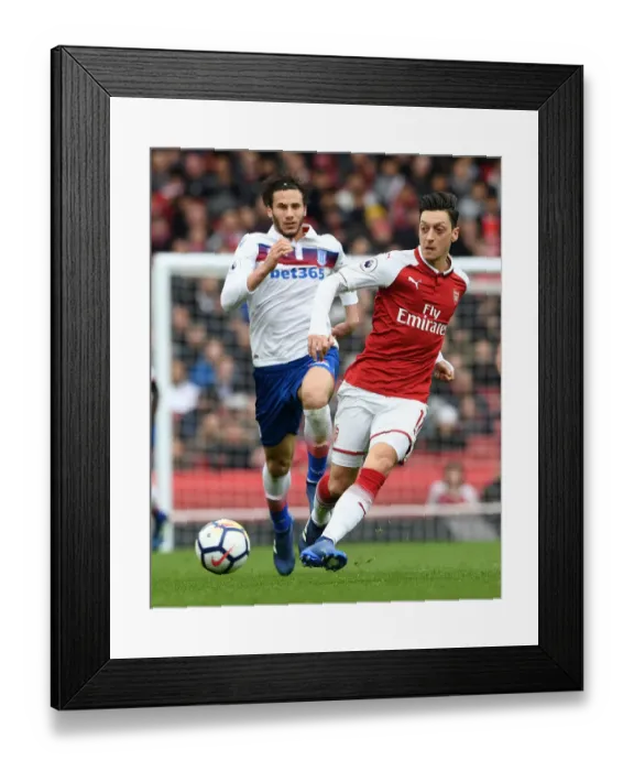 Framed Print : Mesut Ozil vs Ramadan Sobhi: Clash at the Emirates - Arsenal v Stoke City, Premier League Framed Print : Mesut Ozil vs Ramadan Sobhi: Clash at the Emirates - Arsenal v Stoke City, Premier League