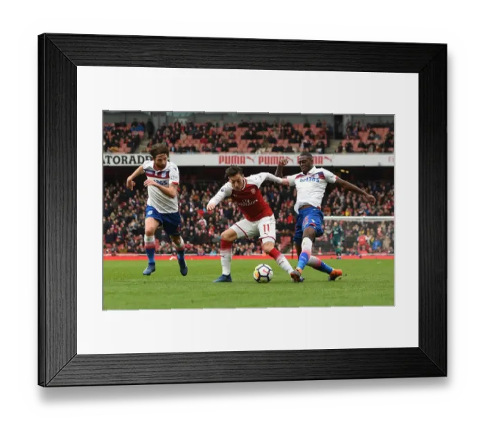 Framed Print : Mesut Ozil (Arsenal) is fouled by Bruno Martins Indi (Stoke). Arsenal 3: 0 Stoke City