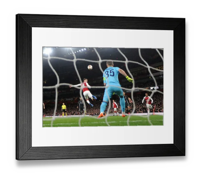 Framed Print : Aaron Ramsey Scores Third Goal Against Igor Akinfeev in Arsenal's Europa League Quarterfinal vs CSKA Moscow Framed Print : Aaron Ramsey Scores Third Goal Against Igor Akinfeev in Arsenal's Europa League Quarterfinal vs CSKA Moscow