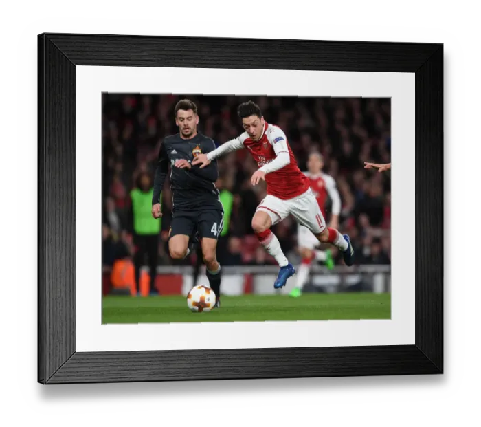 Framed Print : Mesut Ozil vs. Georgi Schennikov: A Battle in the Arsenal FC vs. CSKA Moskva UEFA Europa League Quarterfinal